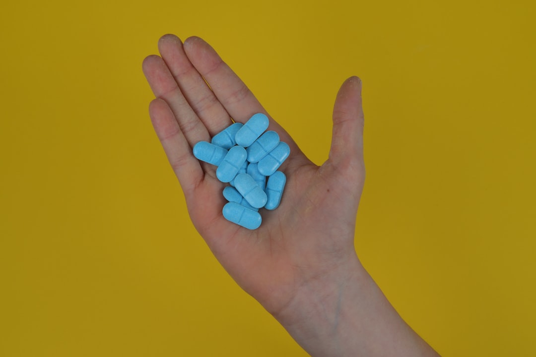a hand with blue nails