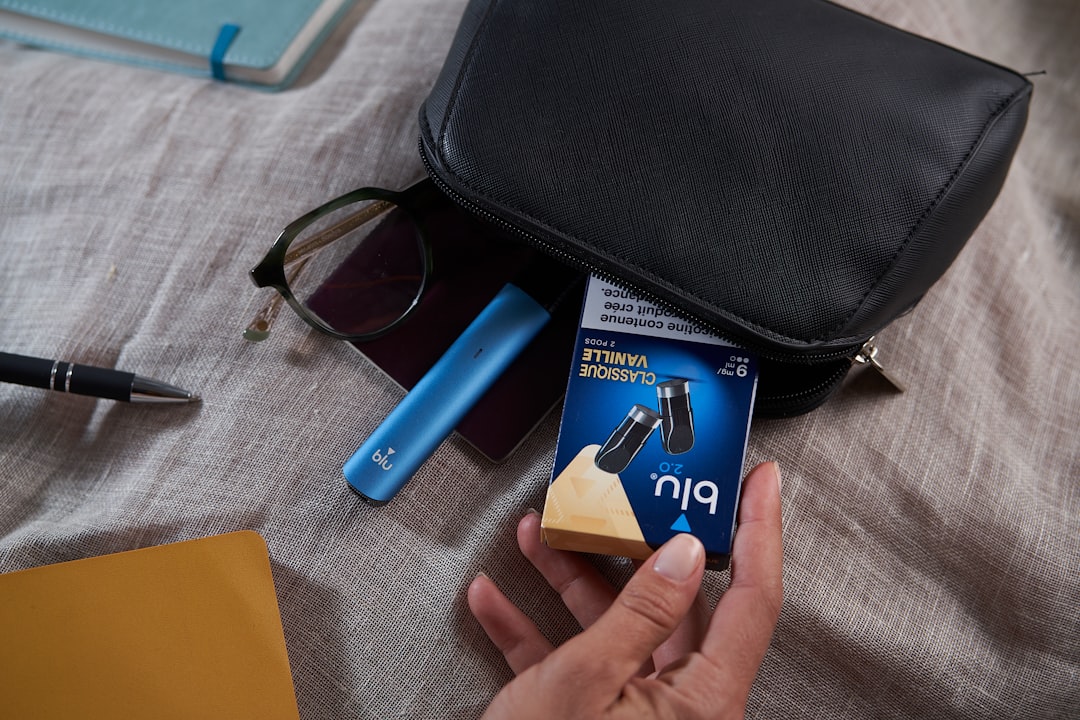 A person is holding a cell phone in their hand