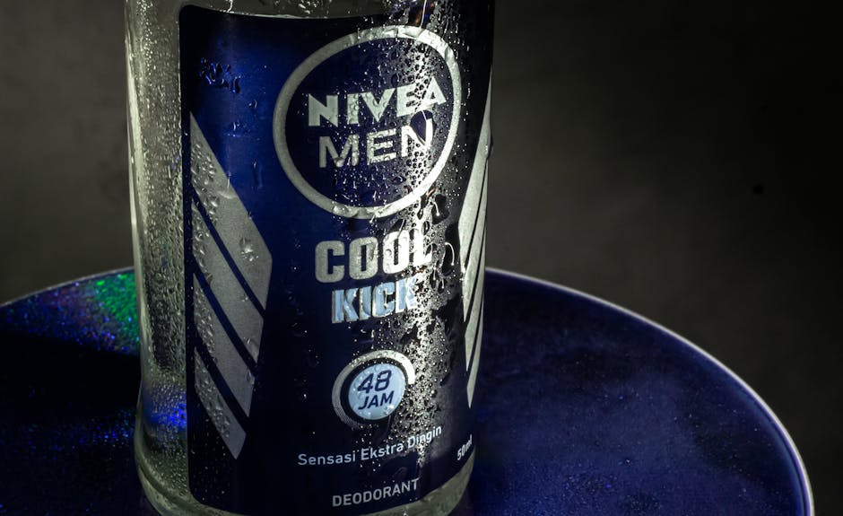 A refreshing close-up of Nivea Men Cool Kick deodorant with water droplets.