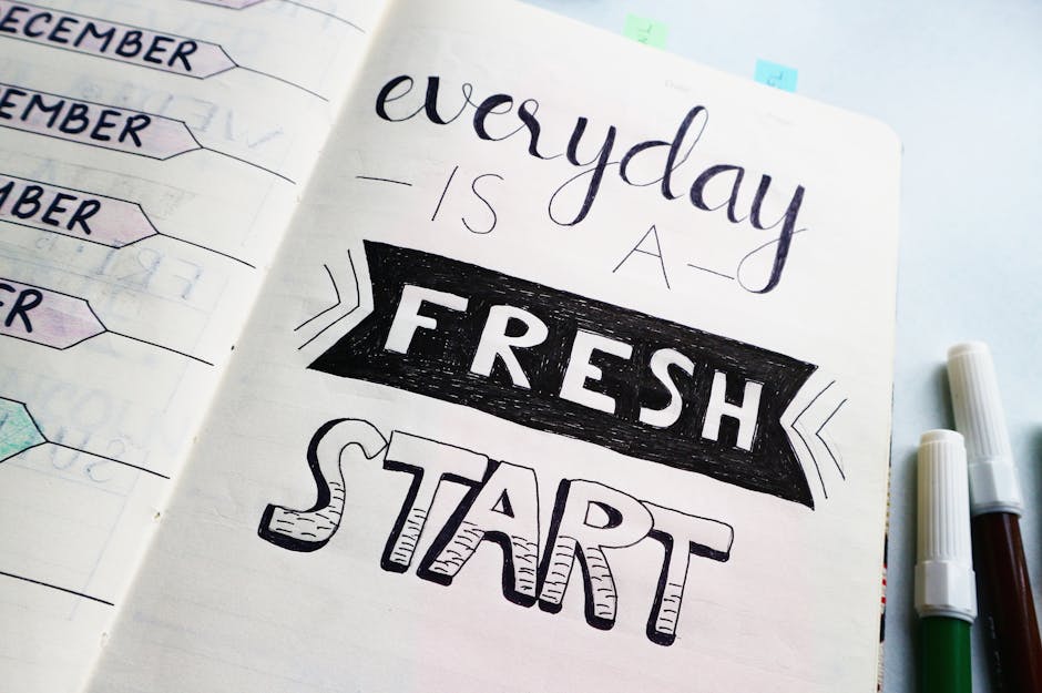 Notebook page featuring motivational quote 'Everyday is a fresh start' with colorful pens.