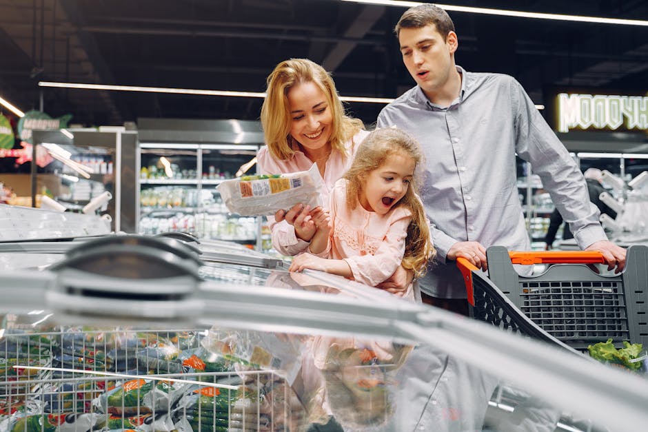 Happy family spending time together shopping at a grocery store.