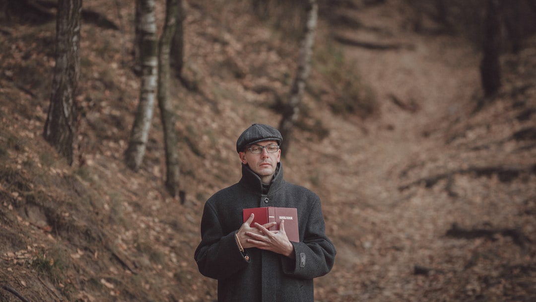 a man holding a book