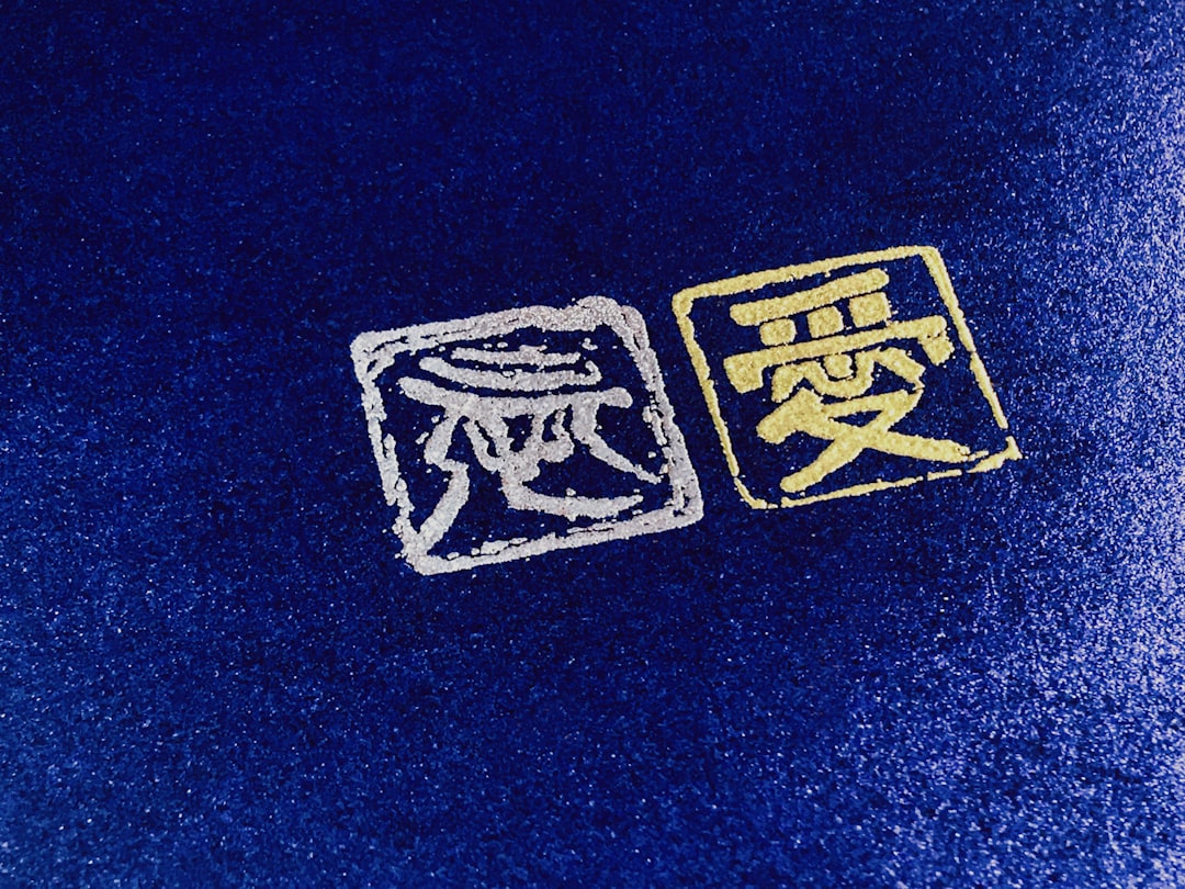 a close up of a blue surface with two symbols