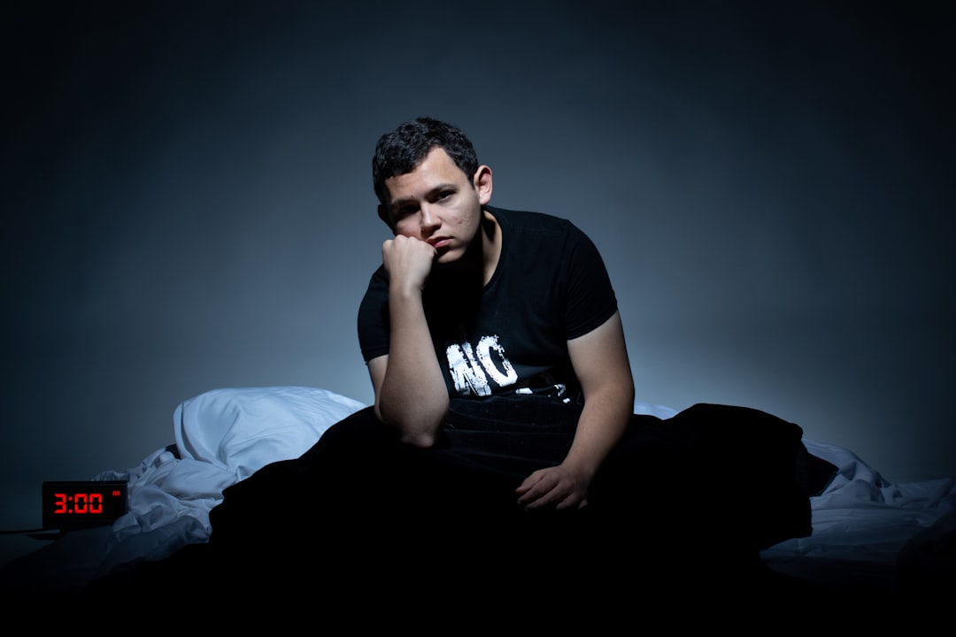 a man sitting on a bed